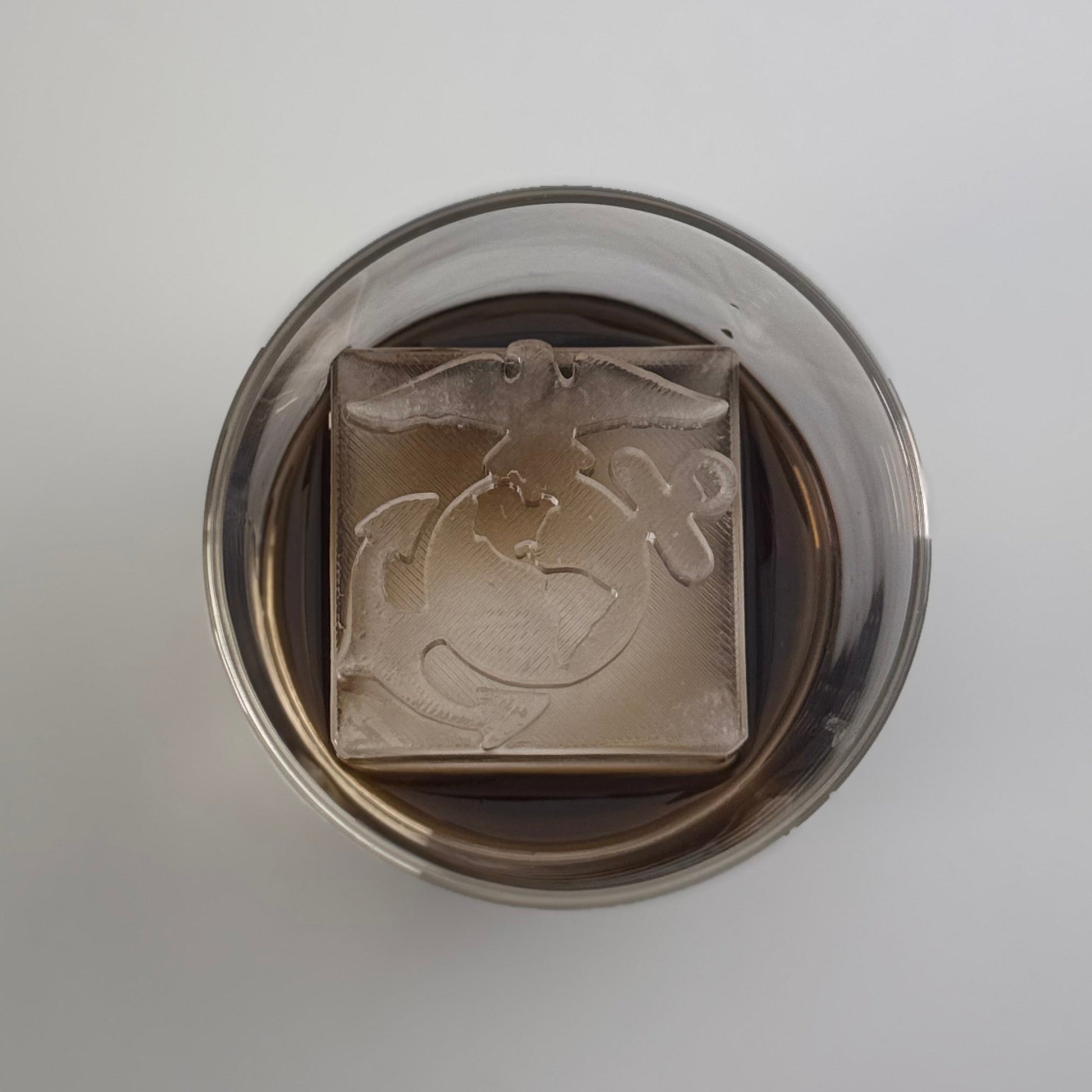 Drinks Glass with a EGA design on a ice cube.