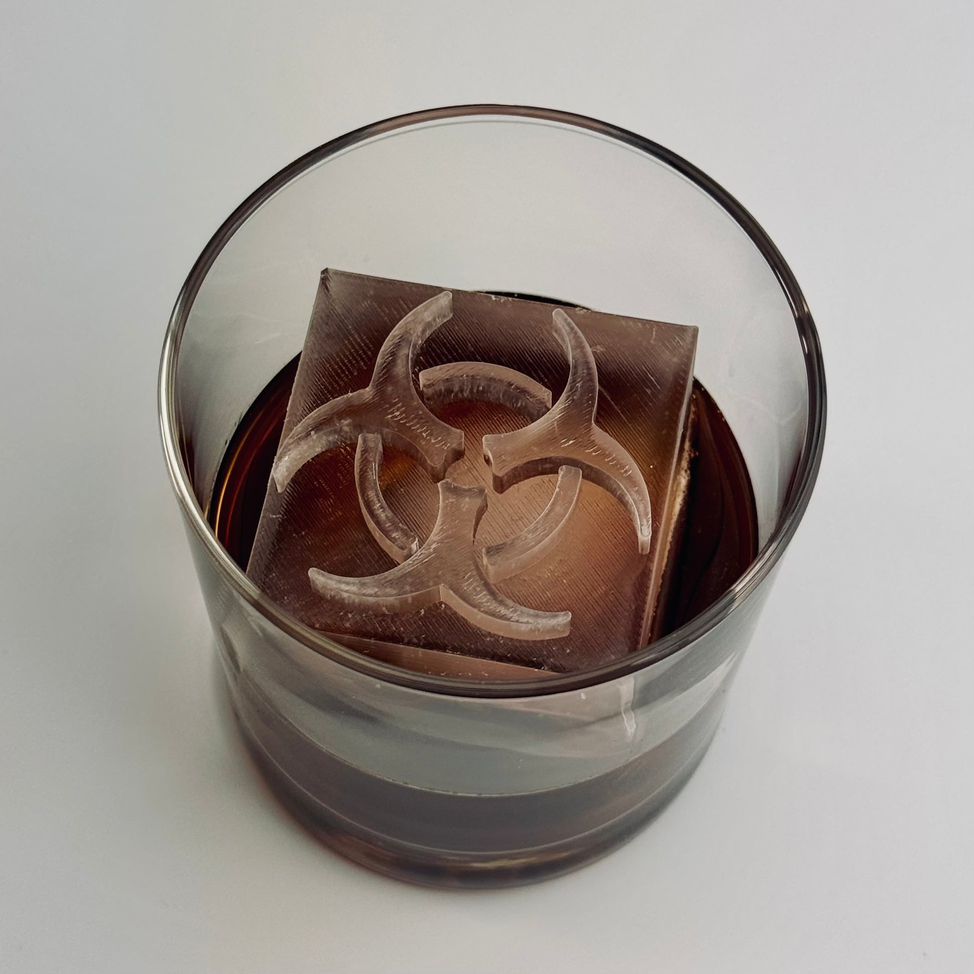 Zombie-themed cocktail featuring biohazard ice cube
