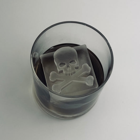Glass with a skull and crossbones design on a white background