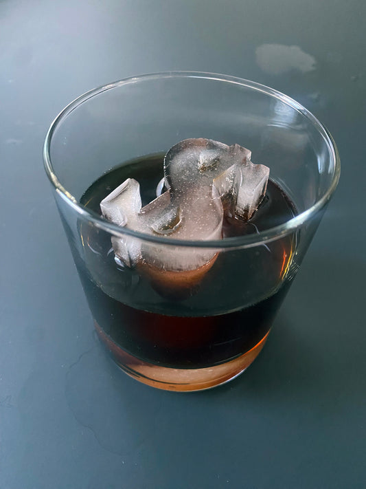 Molde para hielo con forma de signo de dólar